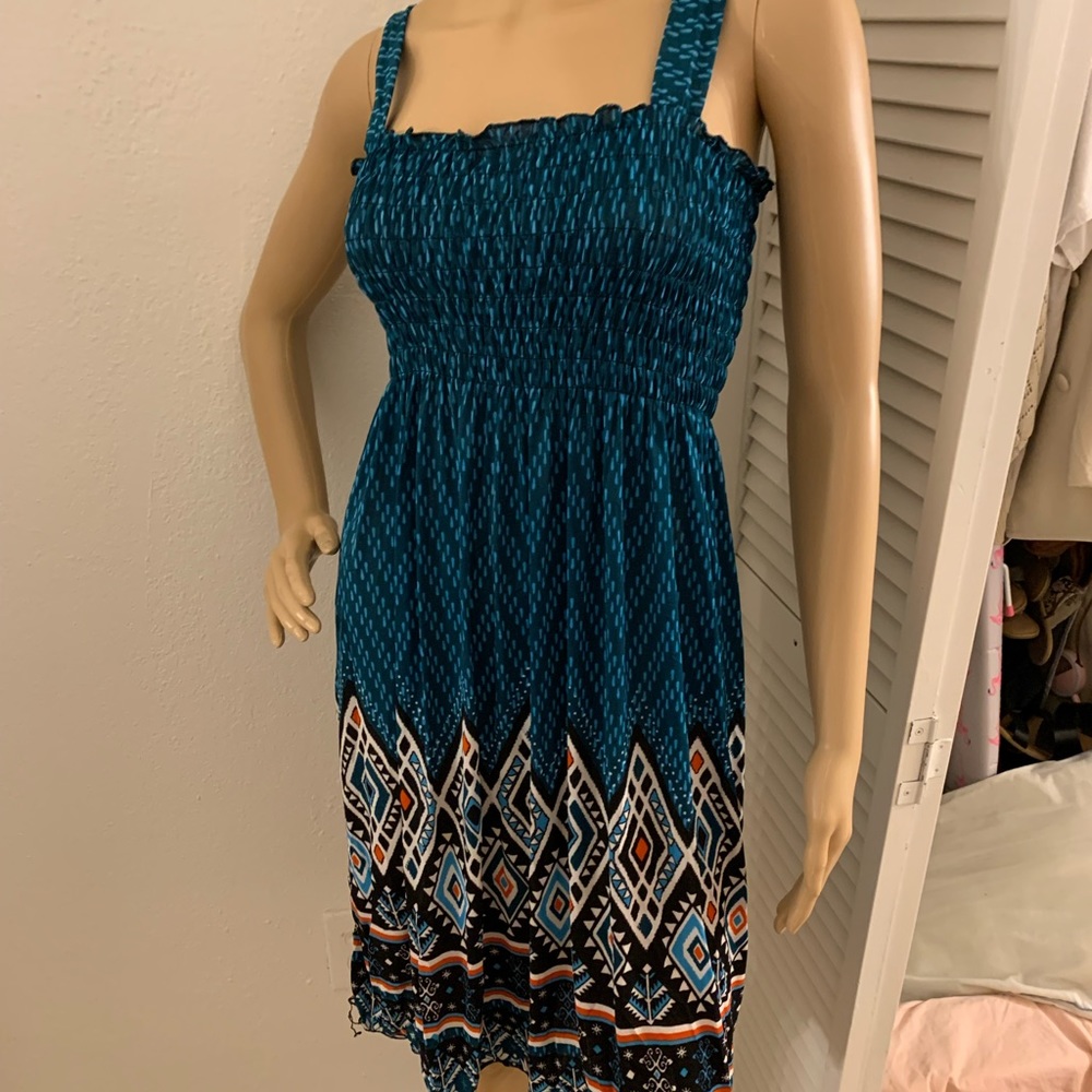 Small/medium sun dress. Turquoise print and lightweight fabric.
